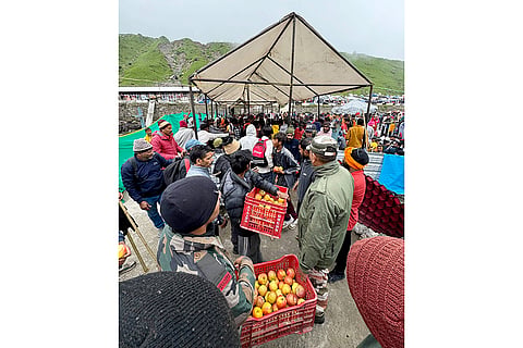 Stranded pilgrims being offered assistance at a relief camp